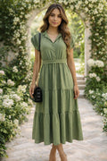 Vestido verde con corte que estiliza