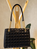 Bolsa negra acolchada Michael Kors